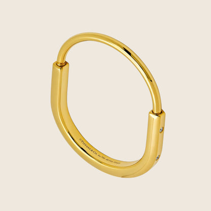 Tiffany & Co. Lock Bangle in Yellow Gold with Diamond Accents 70185407